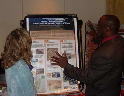 Photo of Susan Tiano, Director of the Latin American and Iberian Institute, and Finnie Coleman, Interim Dean of University College discussing the EPSCoR program