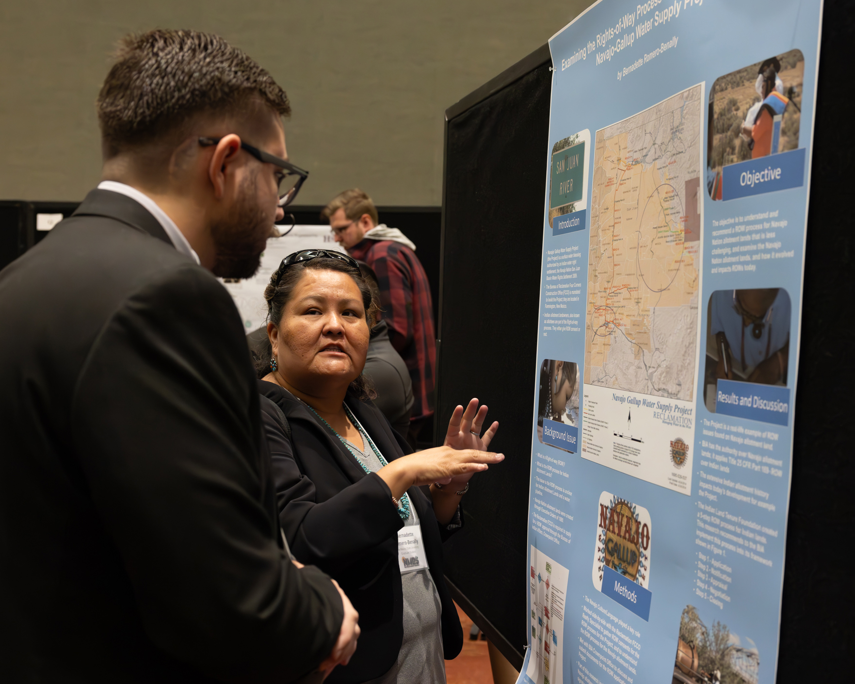 woman scientist sharing her research. Photo credit: Bret Latter