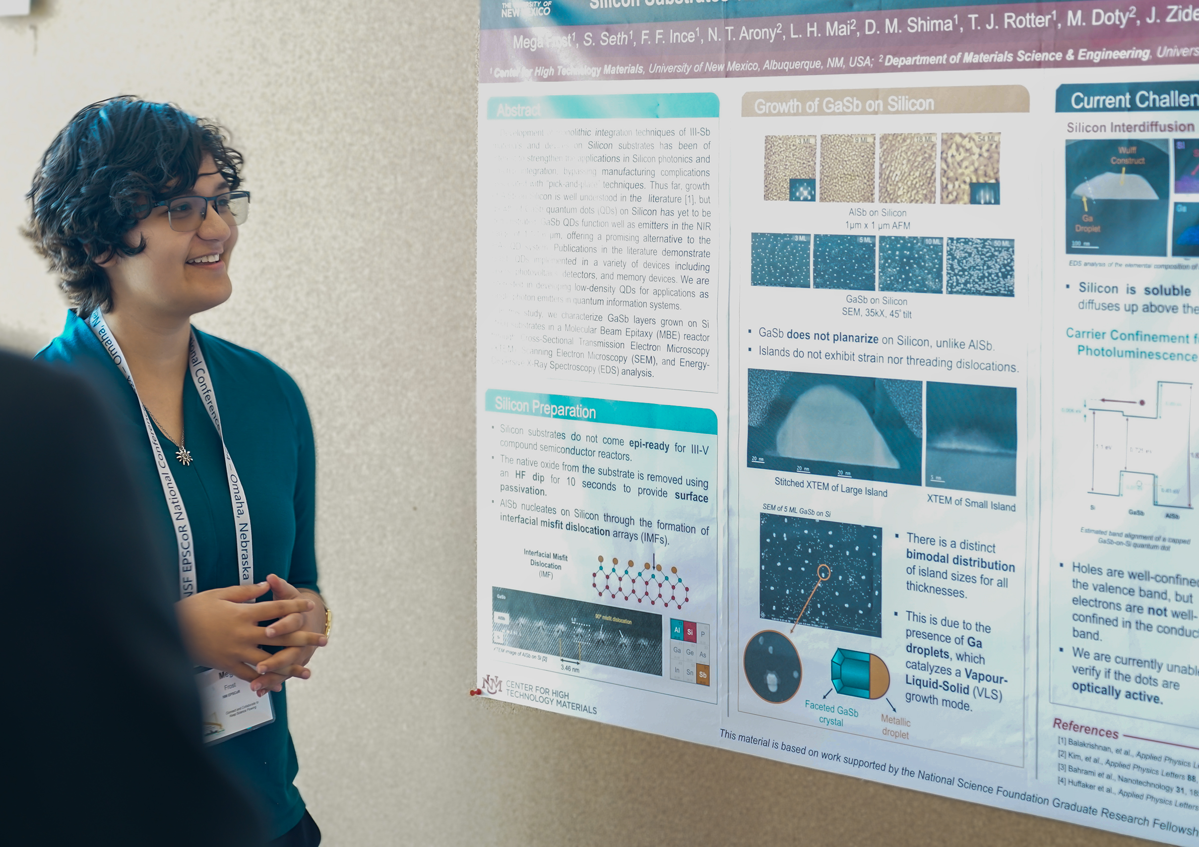 female PhD student in front of research poster