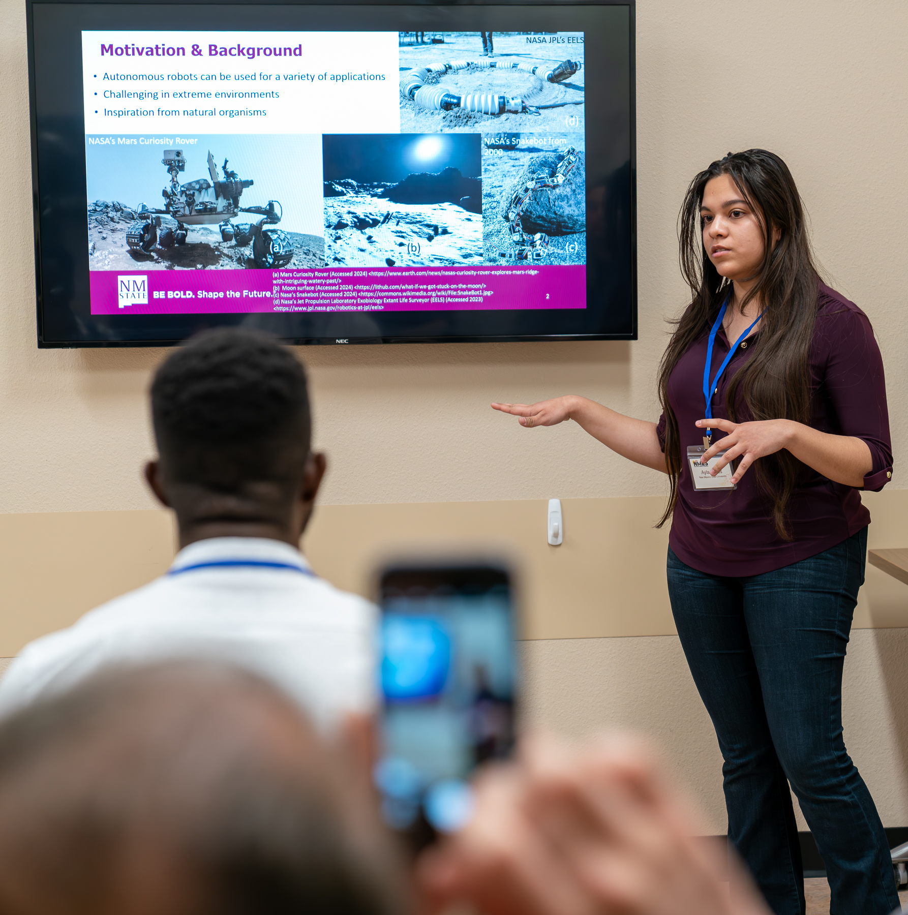 woman giving a presentation in front of others